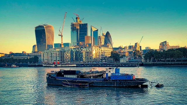 ship, river, city, buildings, skyscrapers, skyline, urban, financial district, downtown, metropolis, boat, travel, thames, river thames, london, england, uk, united kingdom. What financial adviser marketing rules apply in the UK?