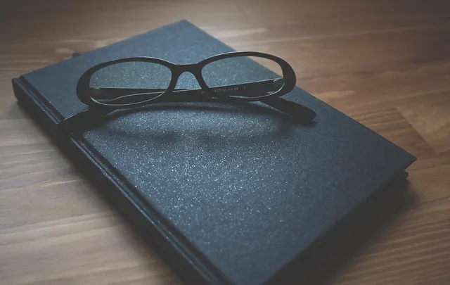 glasses, notebook, wooden, business, business woman, professional, table, women, office, workplace, working woman, woman business. Thought leadership content that generates B2B leads for professional firms
